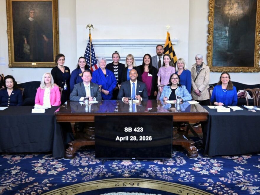 An image of Maryland Governor, Wes Moore, signing SB 423.